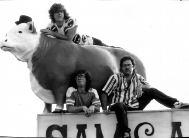 Smokin’ Dave and the Premo Dopes with the cow on top of Sam and Andy's